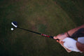 Golfer lining up a shot, representing precise distance measurement