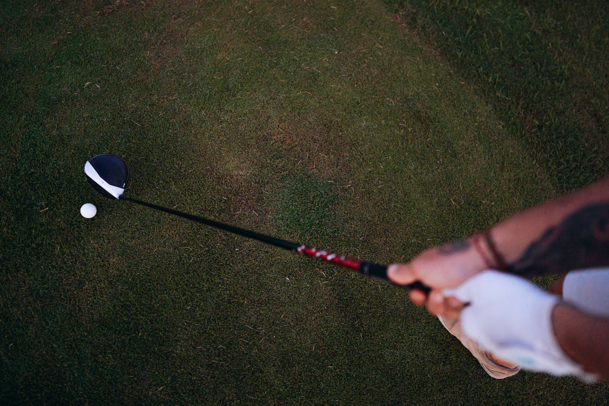 Golfer lining up a shot, representing precise distance measurement