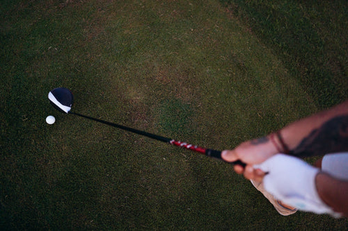 Golfer lining up a shot, representing precise distance measurement