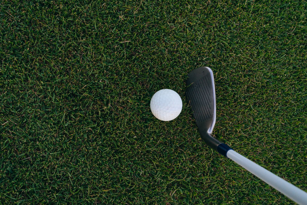 Golf club face and ball close-up, illustrating impact contact point